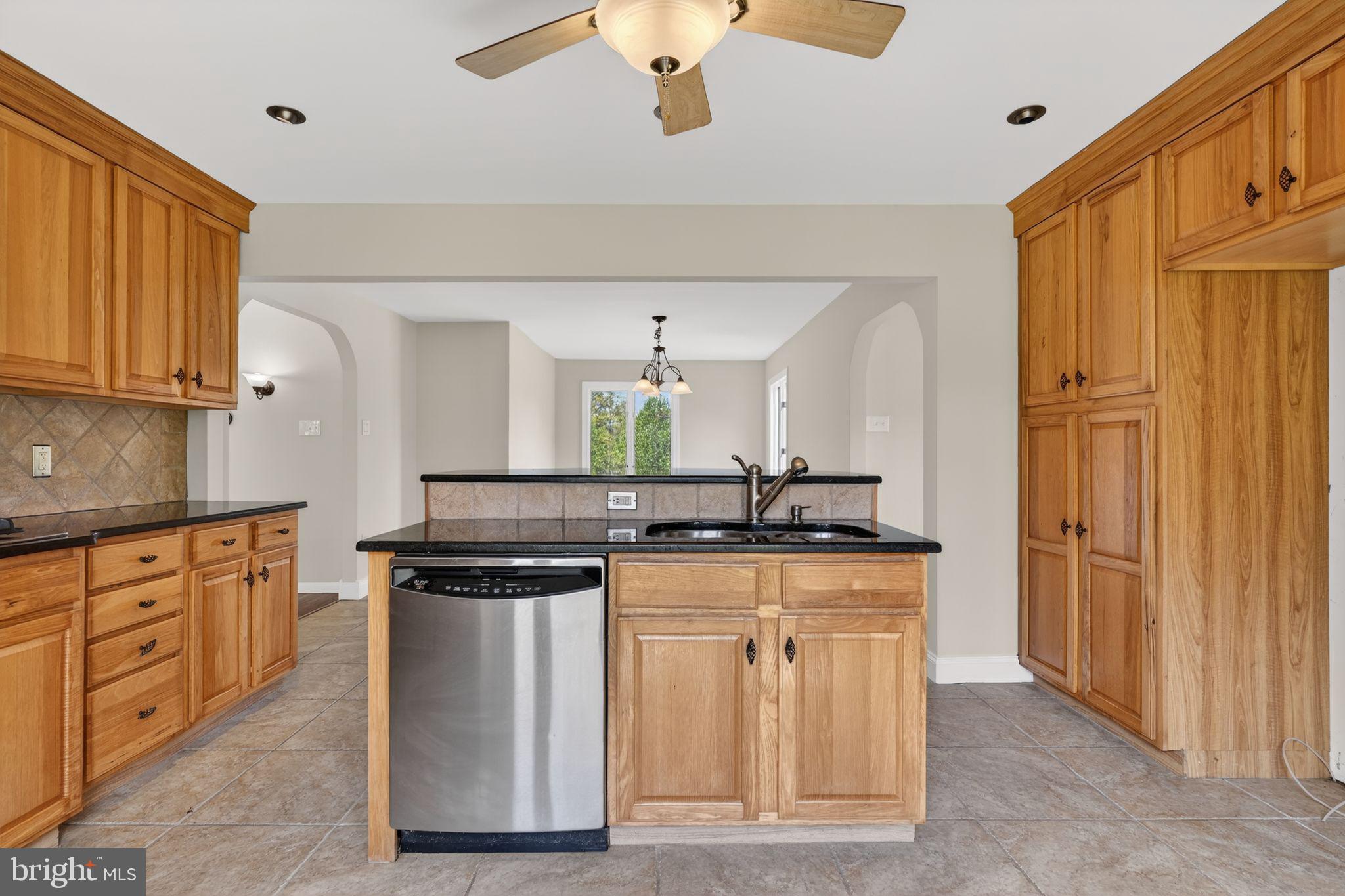26 Sunset Road Royersford, PA 19468 - Photo 9 of 30 a kitchen with stainless steel appliances granite countertop a stove a sink and a refrigerator