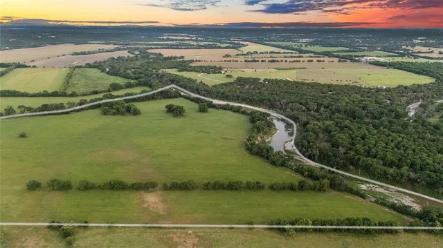 a view of a lake with a yard