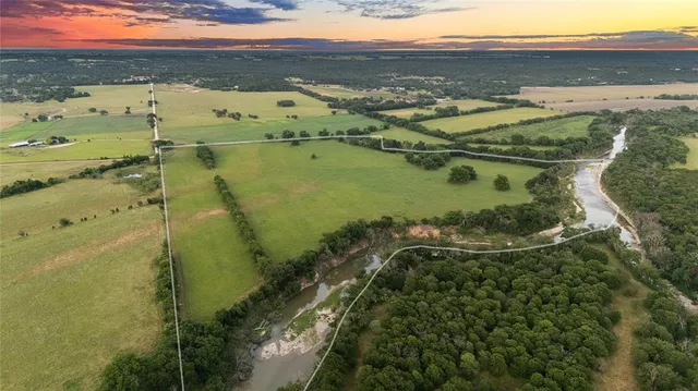 a view of a field with an outdoor space