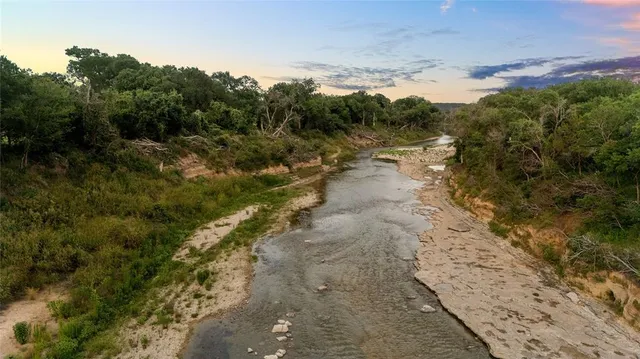 a view of a pathway with a yard