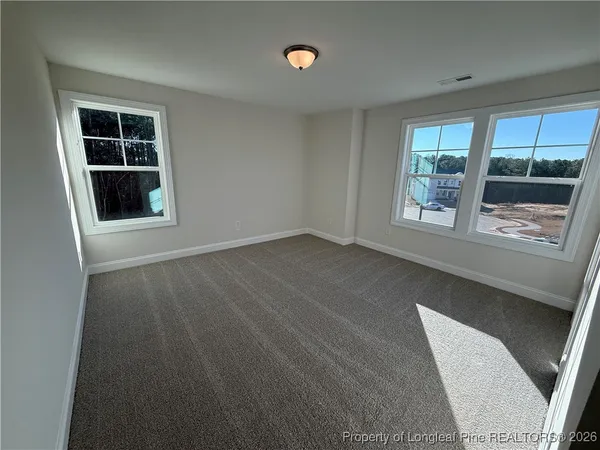 an empty room with windows