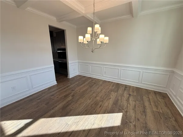 a view of a livingroom with wooden floor