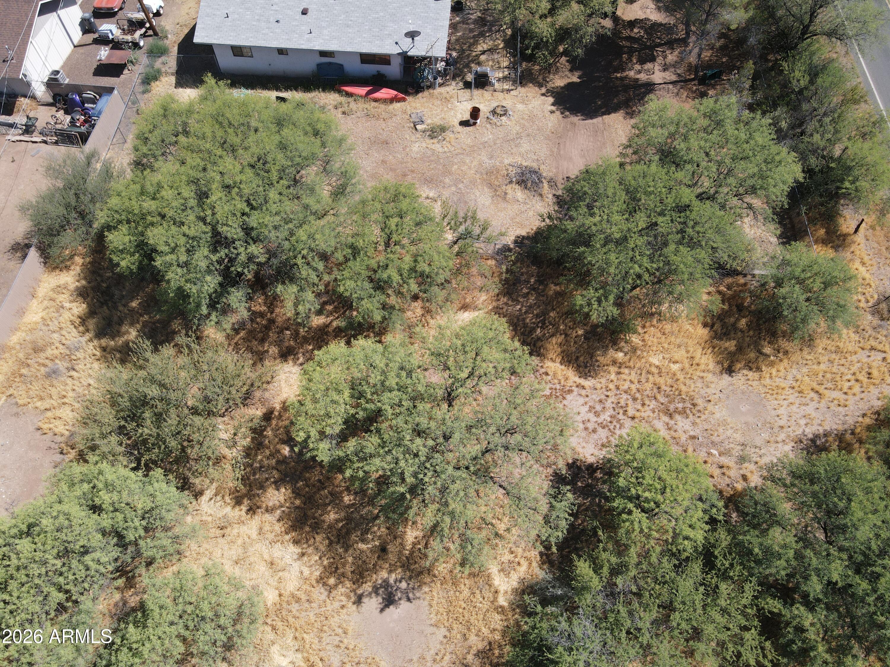 3665 South Salt Mine Road, Unit 27 Camp Verde, AZ 86322 - Photo 15 of 15 an aerial view of a house with yard and trees all around