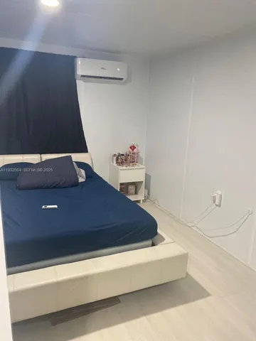 a bedroom with a bed and cabinets