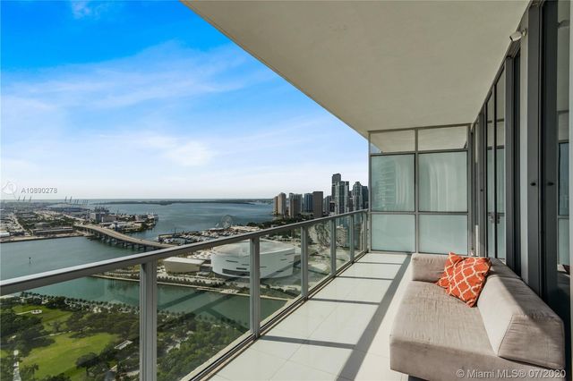 a view of a balcony with furniture
