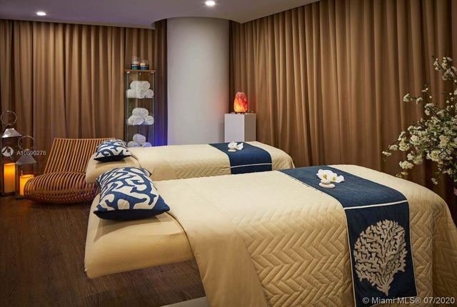 a bedroom with bed and a window