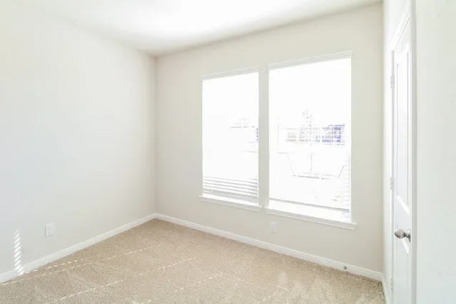 a view of a window in an empty room