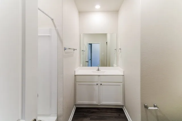 a bathroom with a sink and mirror
