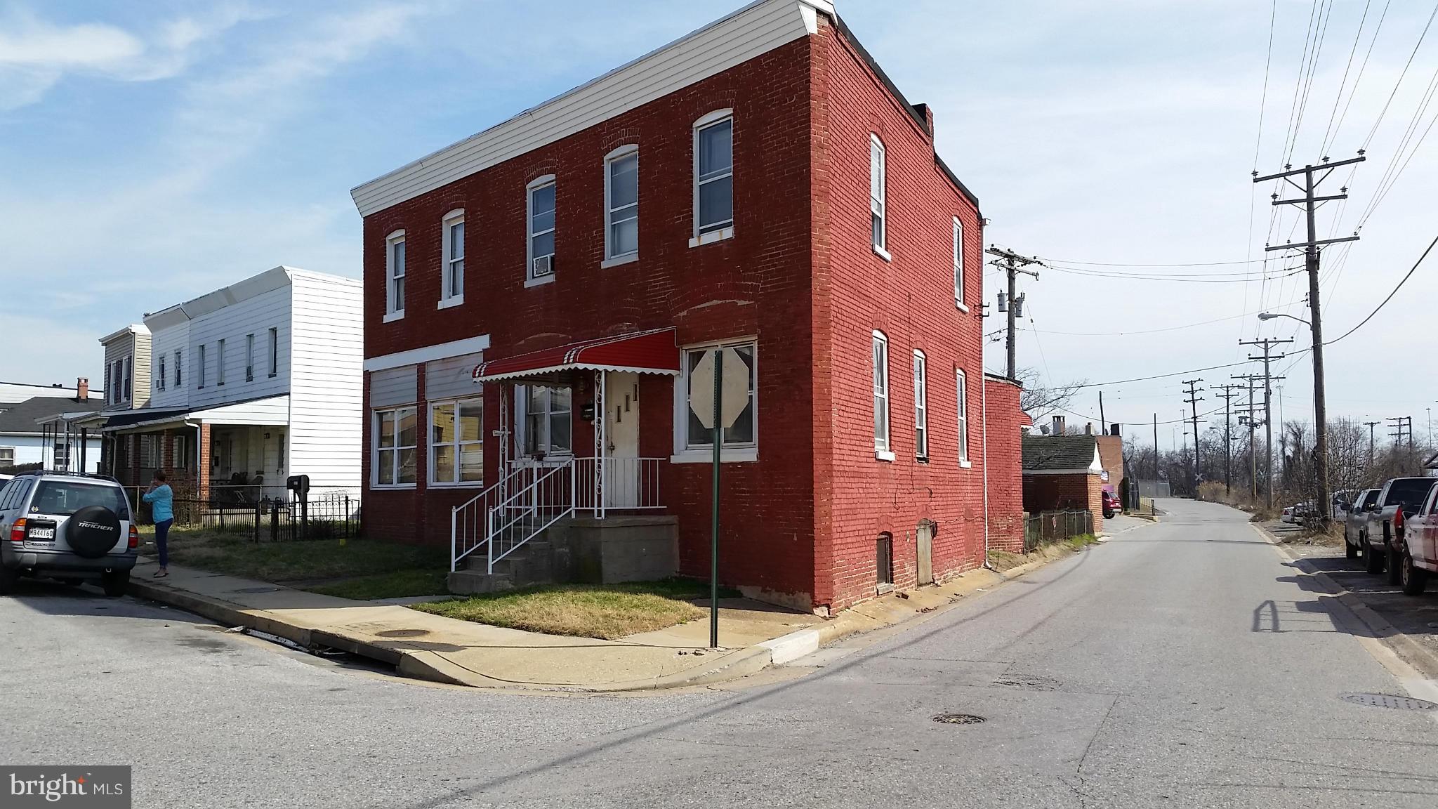 6501 Baltimore Avenue Baltimore, MD 21222 - Photo 1 of 21 a front view of a building with street