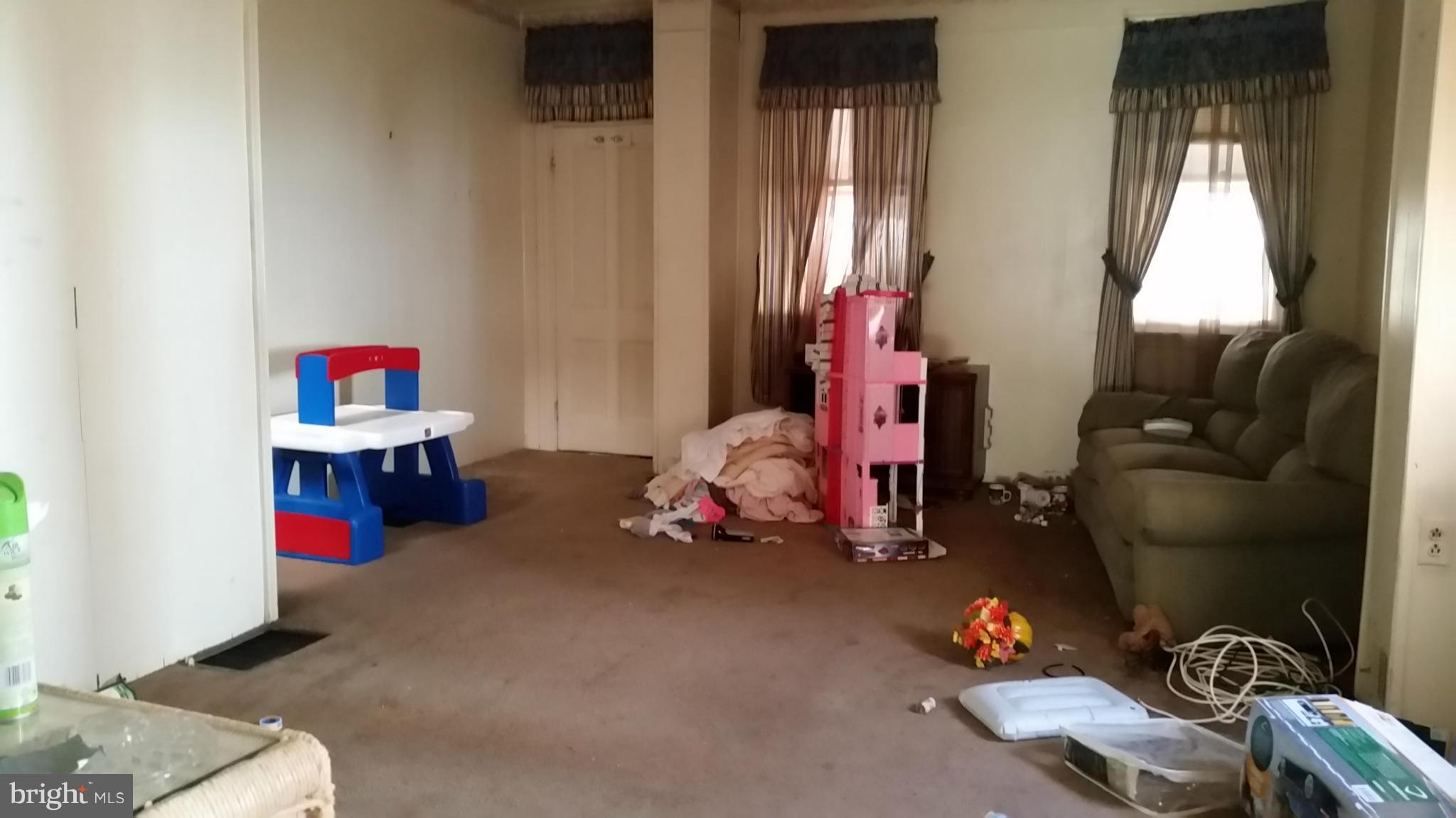 6501 Baltimore Avenue Baltimore, MD 21222 - Photo 14 of 21 a room with toys and storage