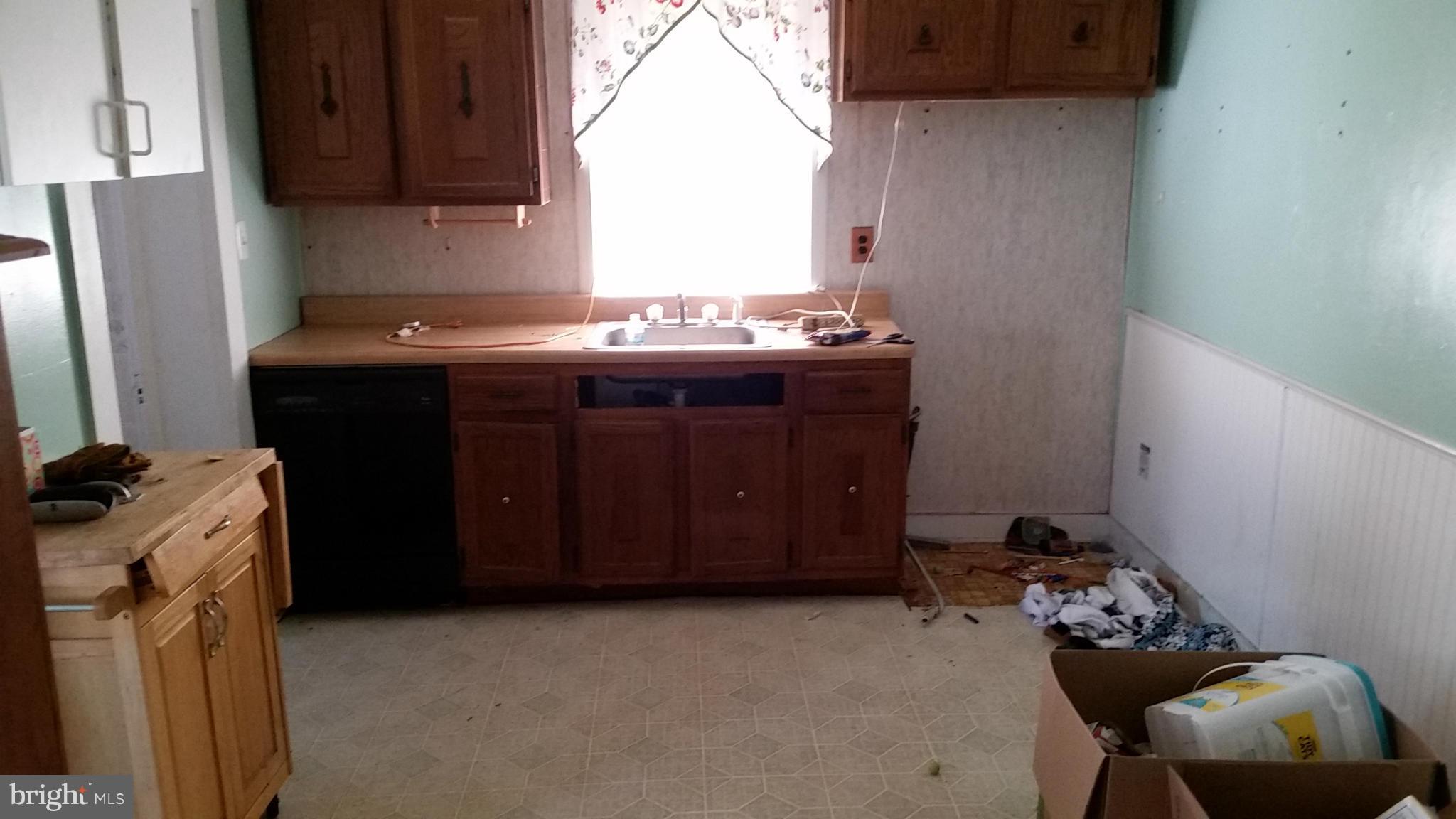 6501 Baltimore Avenue Baltimore, MD 21222 - Photo 15 of 21 a room with cabinets and furniture