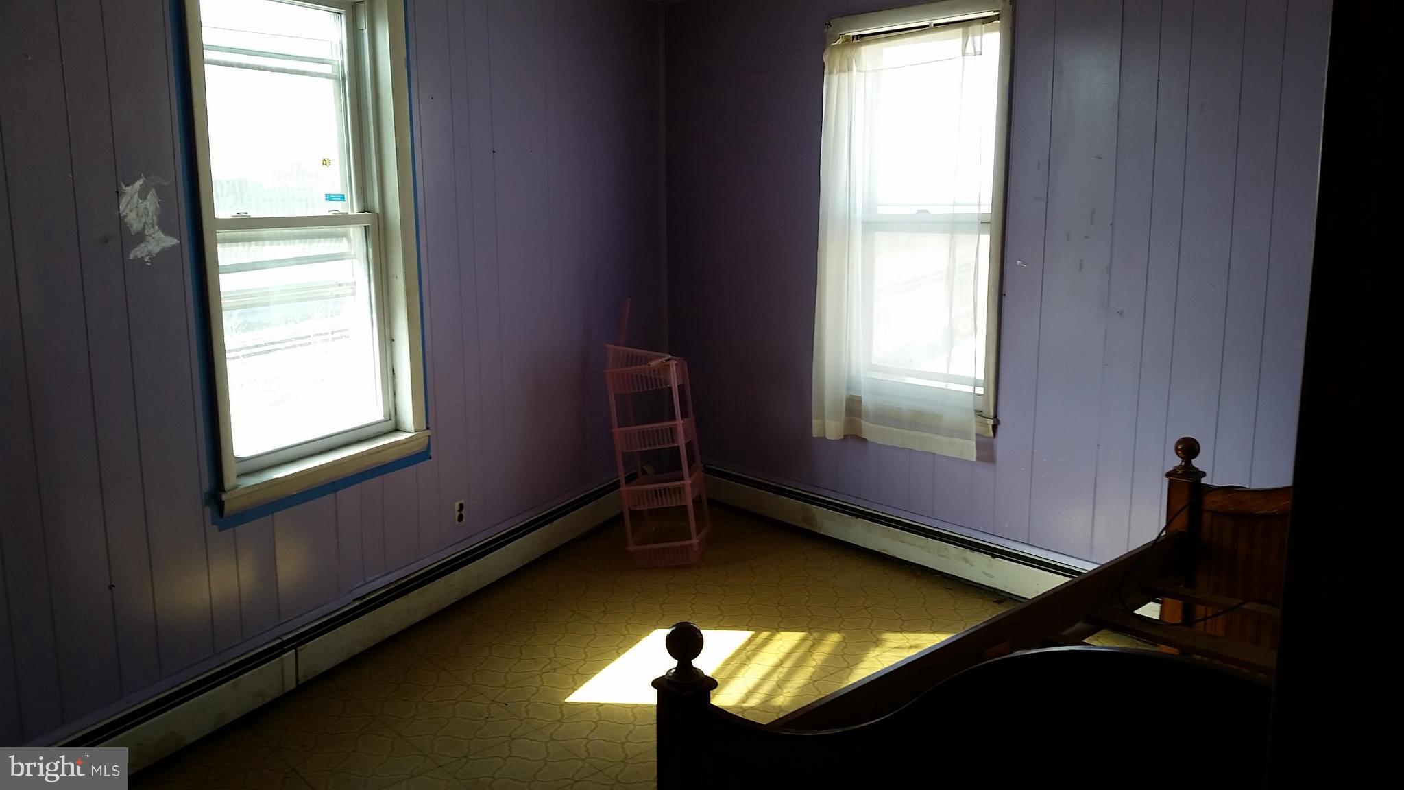 6501 Baltimore Avenue Baltimore, MD 21222 - Photo 3 of 21 a view of an empty room with a window