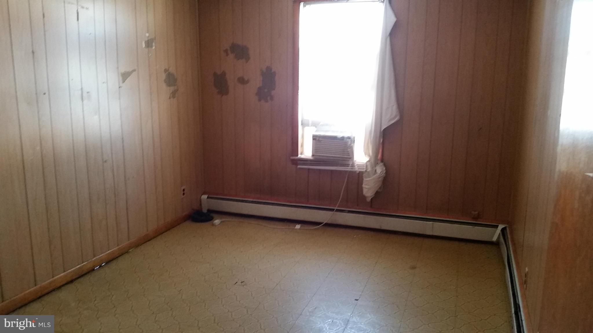 6501 Baltimore Avenue Baltimore, MD 21222 - Photo 4 of 21 an empty room with a window