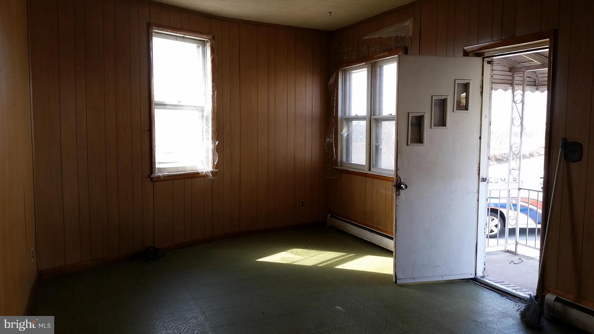 6501 Baltimore Avenue Baltimore, MD 21222 - Photo 10 of 21 a view of empty room with wooden floor and fan
