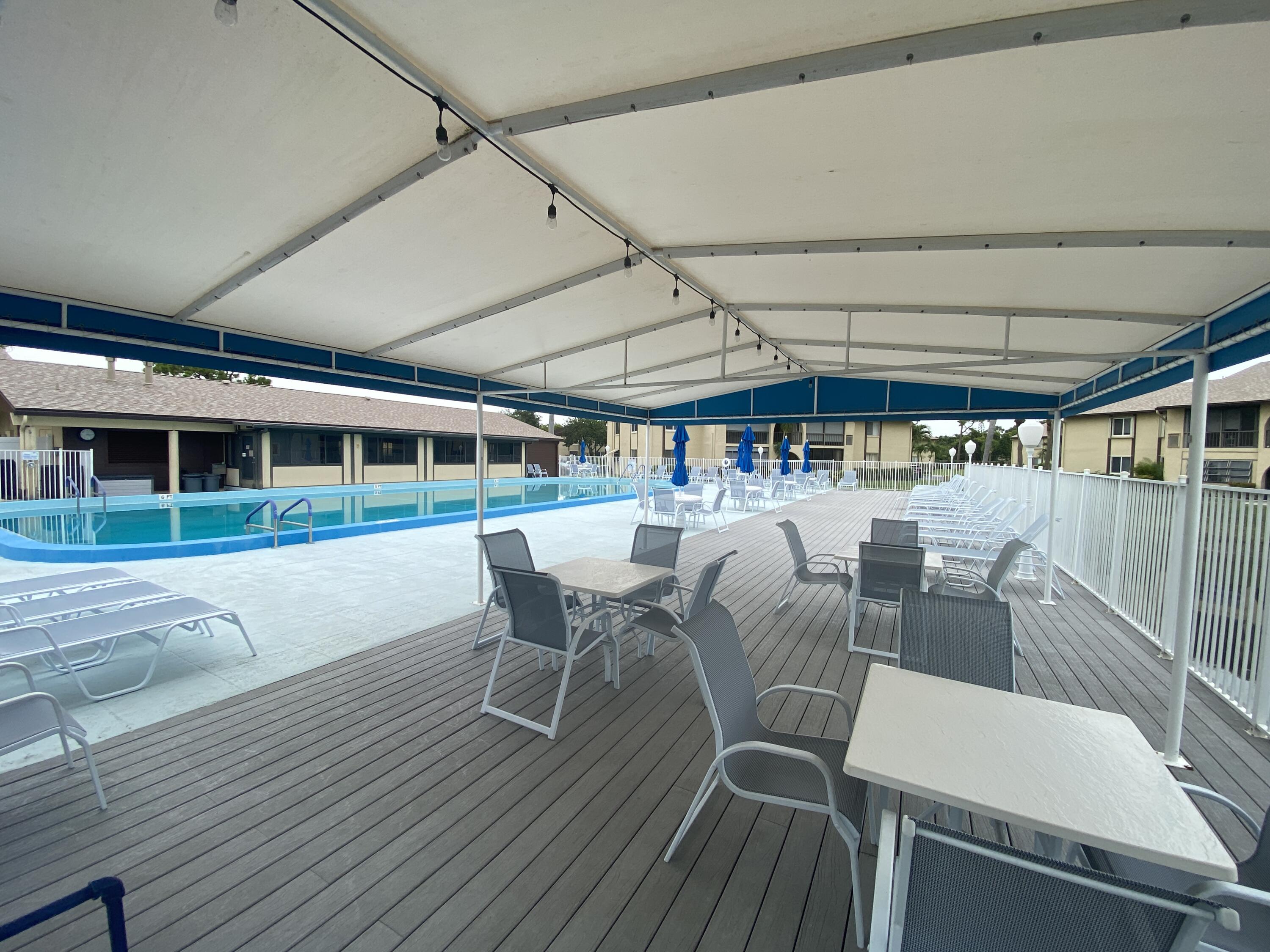 338 Pine Ridge Circle, Unit B2 Greenacres, FL 33463 - Photo 47 of 55 Community Pool Deck