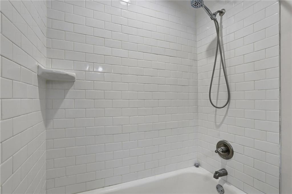 4938 White Boulevard Southwest Mableton, GA 30126 - Photo 24 of 39 a bathroom with a shower and a bathtub