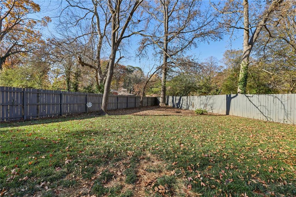 4938 White Boulevard Southwest Mableton, GA 30126 - Photo 32 of 39 a view of backyard with wooden fence