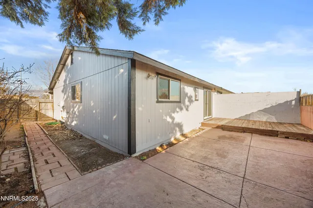 a view of a backyard of the house