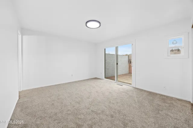 an empty room with an empty space and window