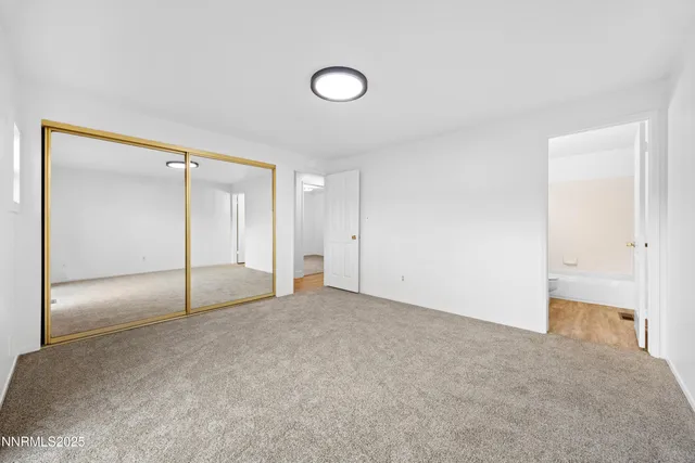 a bathroom with a sink toilet a mirror and shower