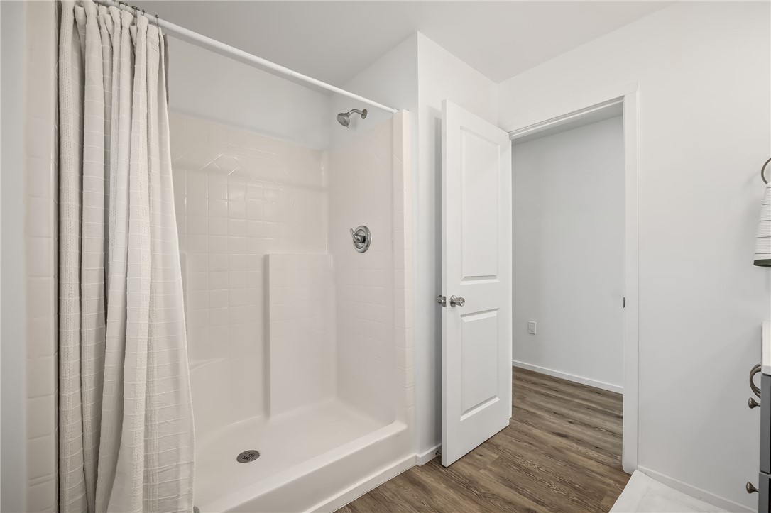 4392 Rio Verde Drive Fort Mohave, AZ 86426 - Photo 15 of 19 White shower enclosure with integrated shelving and chrome fixtures