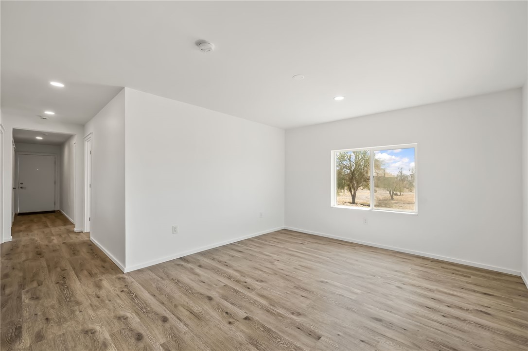 4392 Rio Verde Drive Fort Mohave, AZ 86426 - Photo 10 of 19 Expansive room with wood-finish flooring, recessed lighting, and a large window