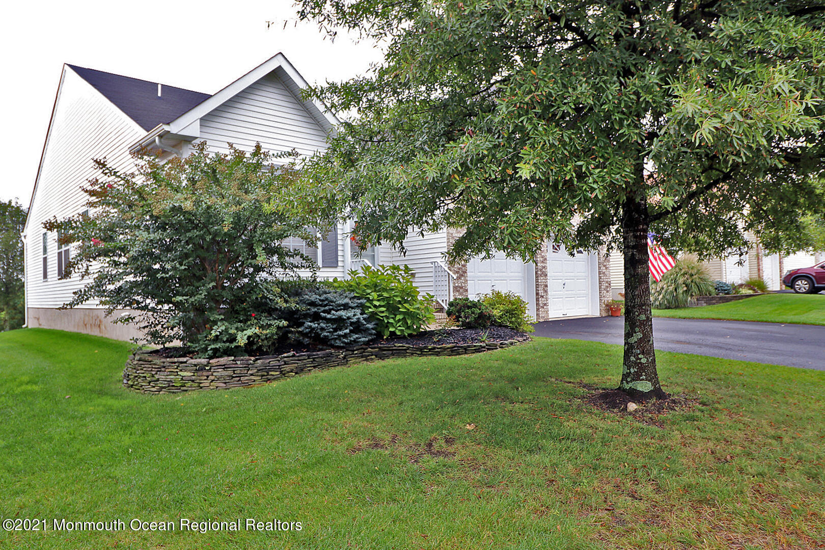 10 Silver Maple Lane Howell, NJ 07731 - Photo 2 of 37 a front view of a house with a yard and tree