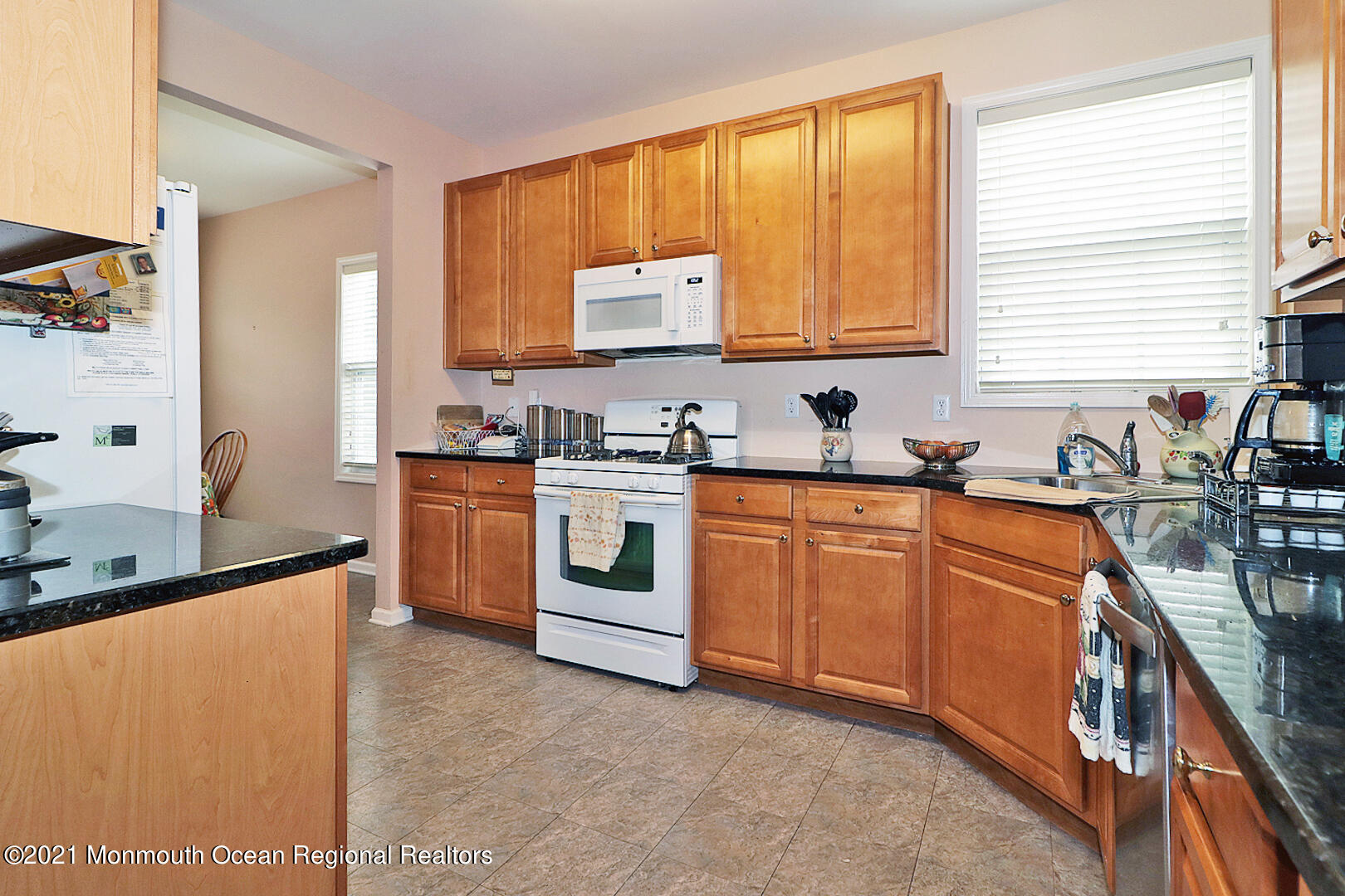 10 Silver Maple Lane Howell, NJ 07731 - Photo 11 of 37 a kitchen with sink a window and appliances