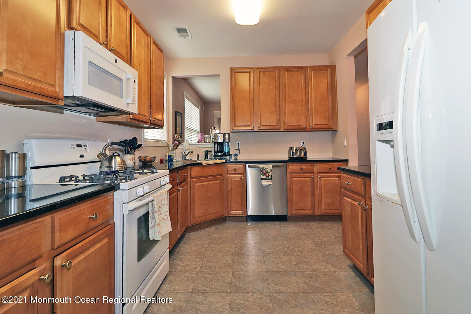 10 Silver Maple Lane Howell, NJ 07731 - Photo 12 of 37 a kitchen with stainless steel appliances granite countertop a stove sink and cabinets