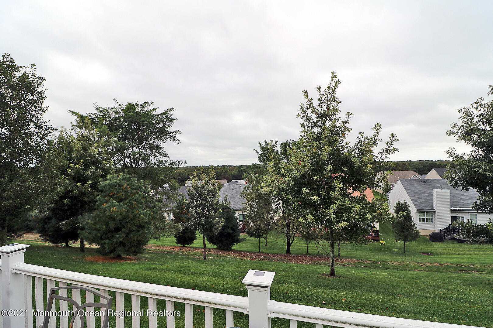 10 Silver Maple Lane Howell, NJ 07731 - Photo 20 of 37 a view of a white house in a big yard with large trees