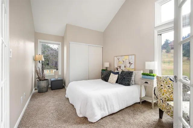 a bedroom with a bed and a desk