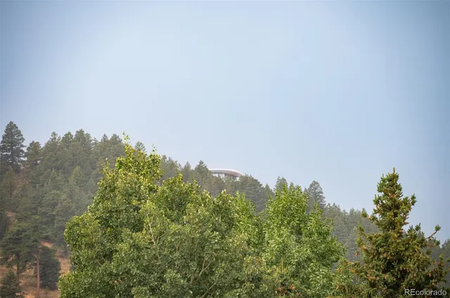 a view of a table and chairs in the garden