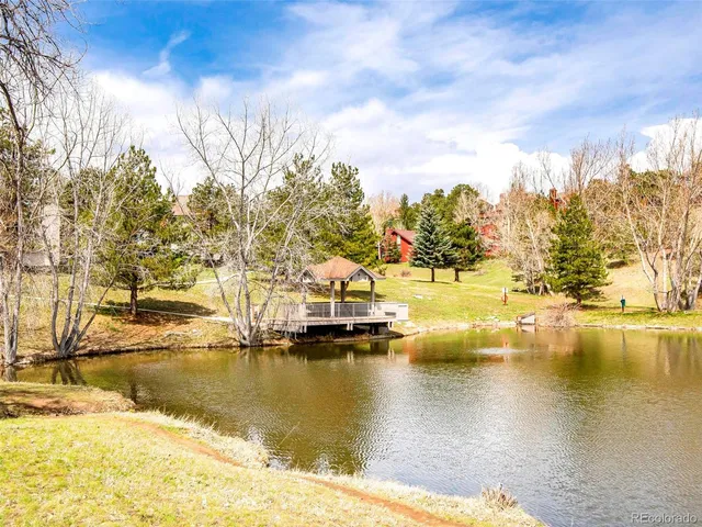 a view of a swimming pool with an outdoor seating