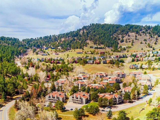 an aerial view of residential building and parking space