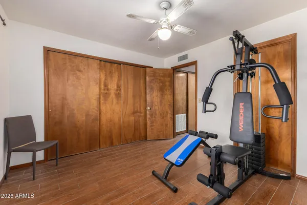 a bathroom with a sink a toilet a mirror and shower curtain