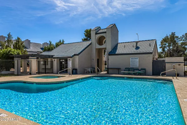 a view of a swimming pool with a lounge chairs