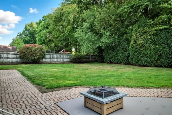 a small garden with a bench
