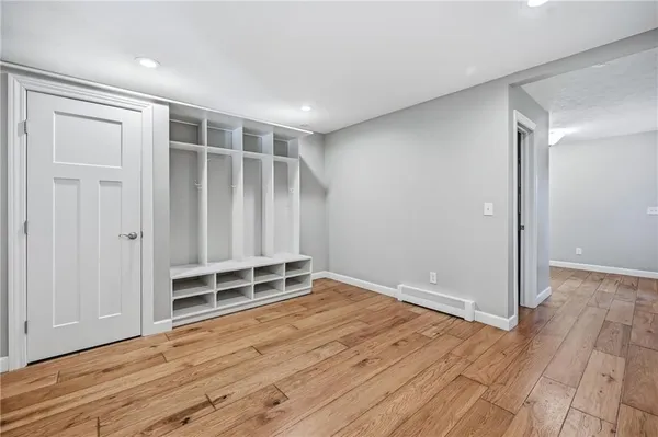 a view of wooden floor and windows in a room