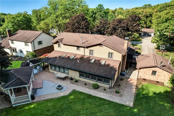 an aerial view of a house with a garden