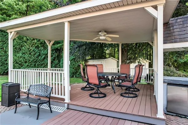 a view of balcony with chairs and wooden floor