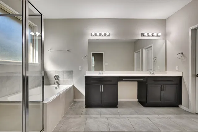 an empty room with closet and windows