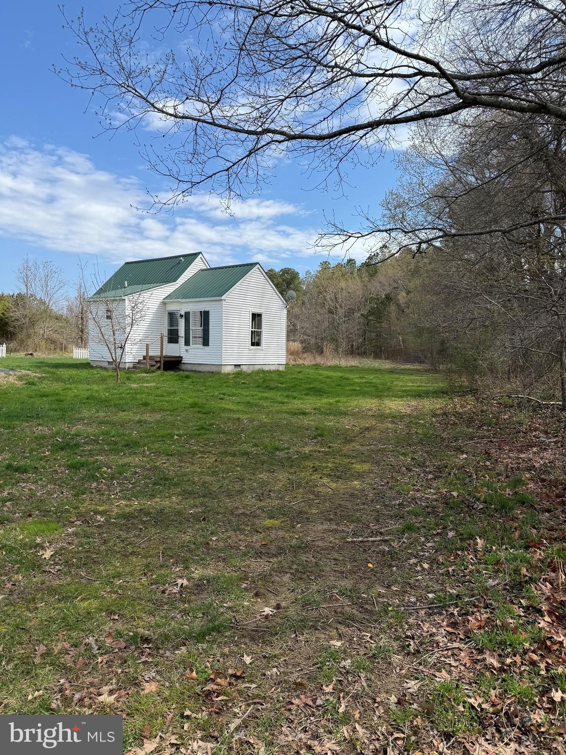 6937 Bellevue Road Royal Oak, MD 21662 - Photo 2 of 9 a view of a yard in front of a house