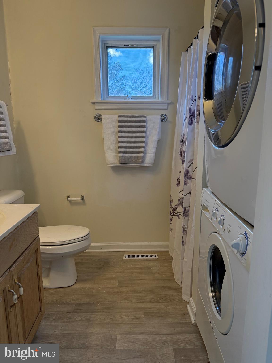 6937 Bellevue Road Royal Oak, MD 21662 - Photo 9 of 9 a bathroom with a toilet and a washing machine