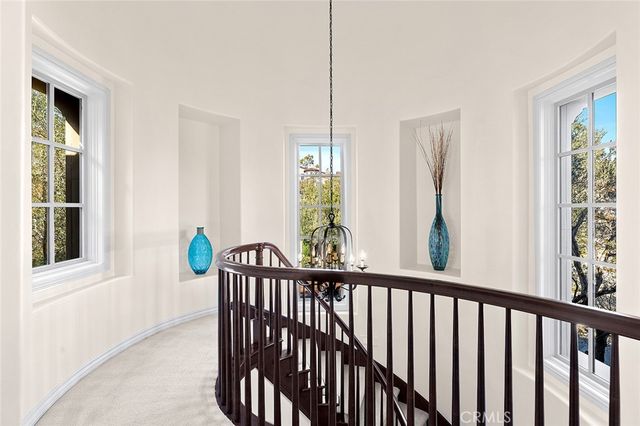 a living room with furniture potted plant and a window