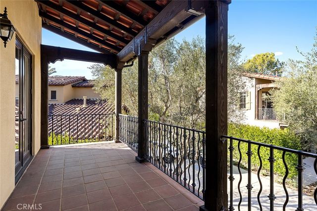 a bedroom with a bed and a large window with outer view