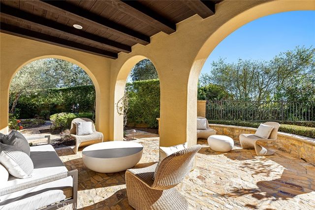 a outdoor space with a table and chairs