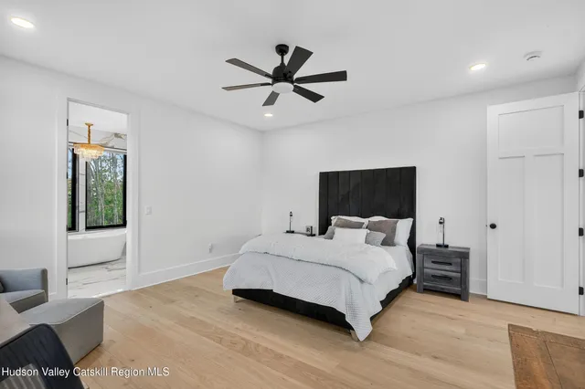 a bathroom with a sink a mirror and a bathtub