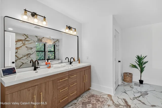 a bathroom with a bathtub and shower