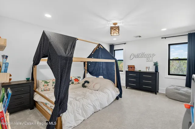 a bathroom with a sink vanity granite and a mirror