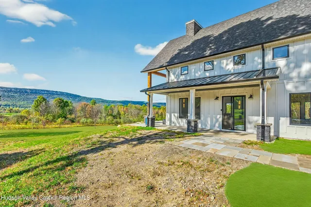 a view of a house with a yard and plants